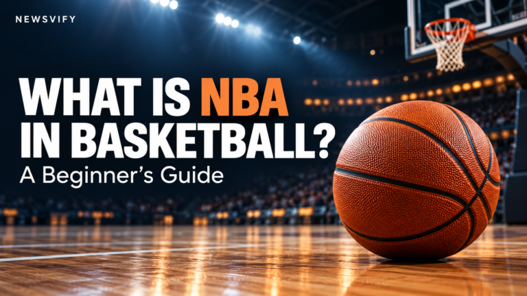 Basketball on an indoor court beneath a hoop, with the headline “What Is NBA in Basketball? A Beginner’s Guide” and Newsvify branding.